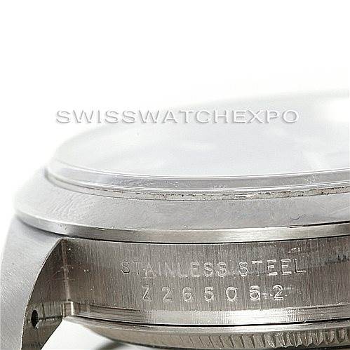 This close-up image shows the side profile of a Rolex Explorer 114270 Men
s Stainless Steel Black Dial 114270 Men
s Stainless Steel Black Dial, highlighting part of the stainless steel case and engraved serial number.