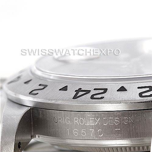Close-up of the Rolex Explorer 16570 Men's Stainless Steel Black Dial 16570 Men's Stainless Steel Black Dial's side profile, showing part of the bezel and the engraved "ORIG. ROLEX DESIGN 16570 T".