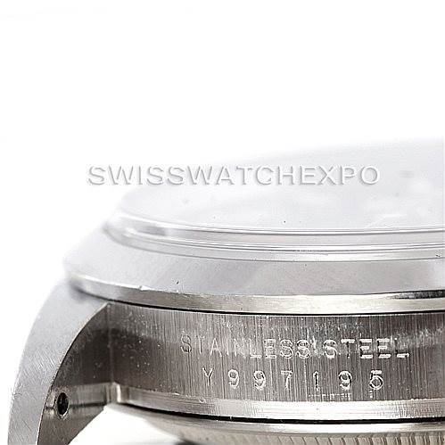 This image shows a close-up of the side of a Rolex Explorer 114270 Men's Stainless Steel Black Dial 114270 Men's Stainless Steel Black Dial watch case, displaying the stainless steel marking and part of the serial number.