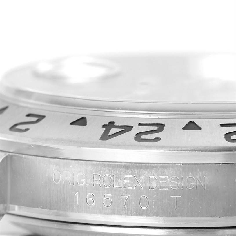 The image shows a close-up side view of the bezel and case engraving of the Rolex Explorer 16570 Men
s Stainless Steel Black Dial 16570 Men
s Stainless Steel Black Dial model 16570.