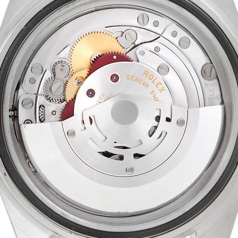 The image shows the internal mechanism of the Rolex Explorer 16570 Men
s Stainless Steel Black Dial 16570 Men
s Stainless Steel Black Dial watch, focused on the movement and gears from a back angle.