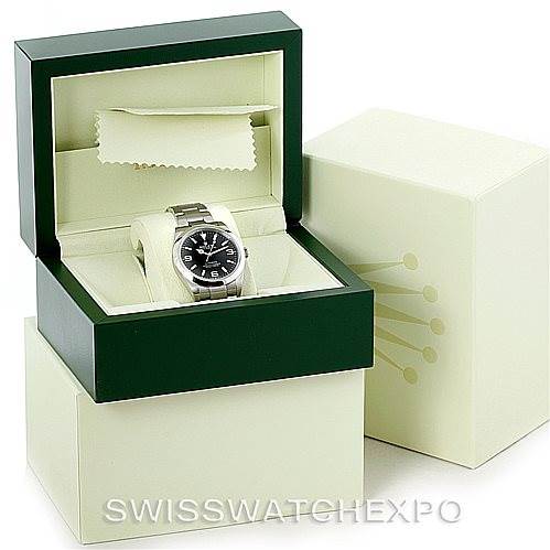 The image shows a Rolex Explorer 214270 Men's Stainless Steel Black Dial 214270 Men's Stainless Steel Black Dial watch in a green and beige Rolex box, viewed from a front angle.