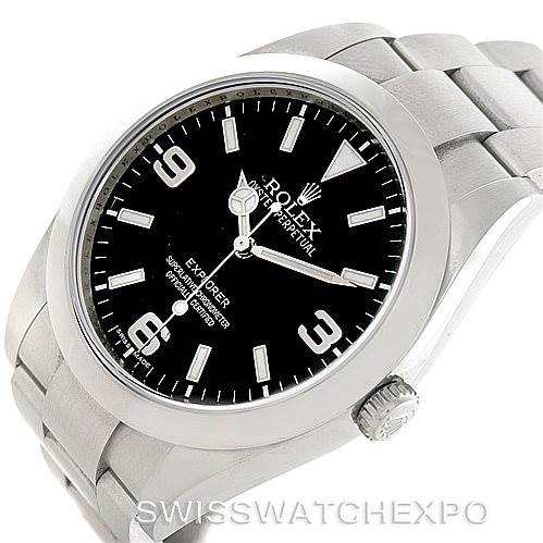 The image shows the Rolex Explorer 214270 Men's Stainless Steel Black Dial 214270 Men's Stainless Steel Black Dial watch at a slight angle, focusing on the black dial, crown, and metal bracelet.