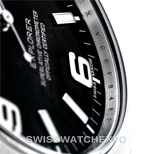 The image shows a close-up angle of the dial on a Rolex Explorer 214270 Men's Stainless Steel Black Dial 214270 Men's Stainless Steel Black Dial watch, highlighting the numerals and inscriptions.