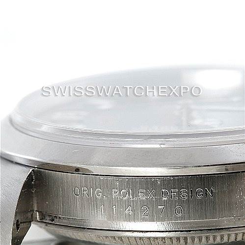 A close-up side view of the Rolex Explorer 114270 Men's Stainless Steel Black Dial 114270 Men's Stainless Steel Black Dial shows the case with "ORIG. ROLEX DESIGN 114270" engraved.