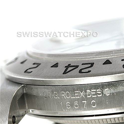 The image shows a close-up angle of the bezel, case, and part of the crystal of the Rolex Explorer 16570 Men
s Stainless Steel White Dial 16570 Men
s Stainless Steel White Dial model.