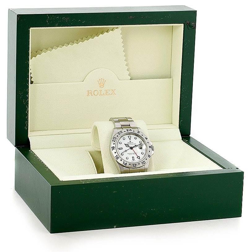The Rolex Explorer 16570 Men's Stainless Steel White Dial 16570 Men's Stainless Steel White Dial watch is displayed at a slight angle in its open green and beige box, showing the face and bezel.