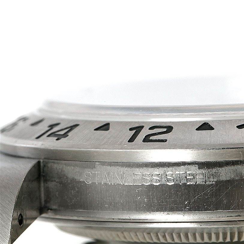 The image shows a close-up side view of the bezel and case of the Rolex Explorer 16570 Men's Stainless Steel White Dial 16570 Men's Stainless Steel White Dial, highlighting the stainless steel construction.