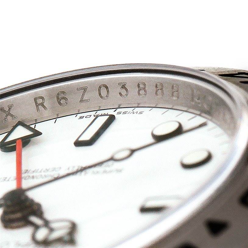 This image shows a close-up of the dial, hands, and rehaut engraving of the Rolex Explorer 16570 Men's Stainless Steel White Dial 16570 Men's Stainless Steel White Dial watch.