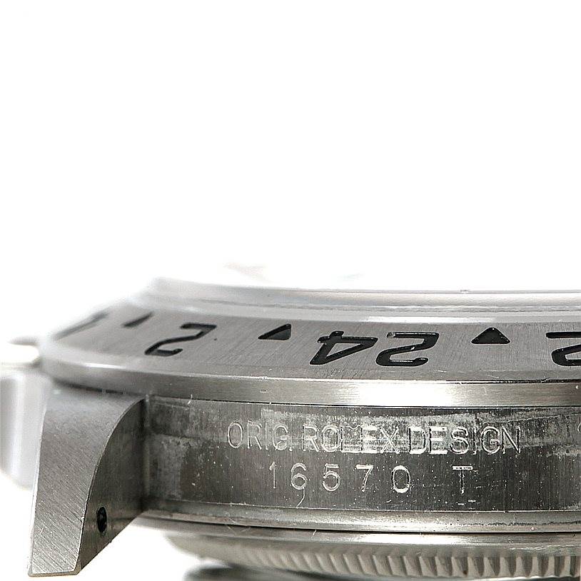 The image shows a side view of the Rolex Explorer 16570 Men's Stainless Steel White Dial 16570 Men's Stainless Steel White Dial watch model 16570, highlighting the bezel and case with engraved details.
