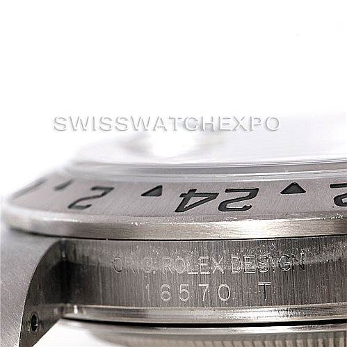 The image shows a close-up view of the bezel and engraved side of the Rolex Explorer 16570 Men's Stainless Steel White Dial 16570 Men's Stainless Steel White Dial model 16570.
