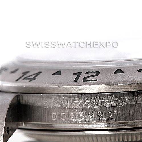 This image shows a close-up of the bezel and casing of a Rolex Explorer 16570 Men's Stainless Steel White Dial 16570 Men's Stainless Steel White Dial model, highlighting the etched markings and serial number.