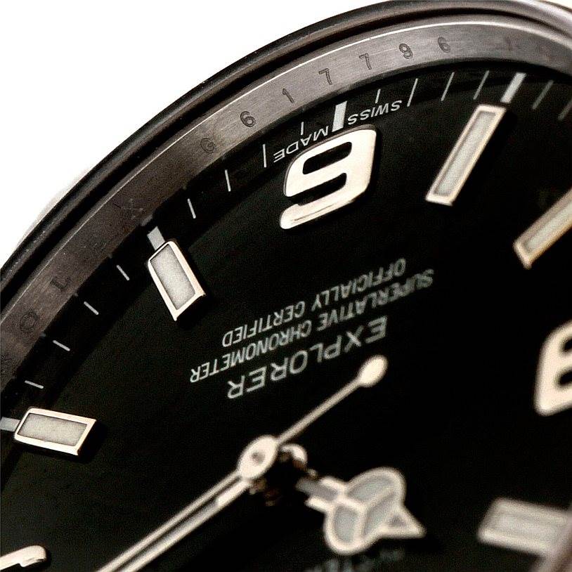 The image shows a close-up angle of the Rolex Explorer 214270 Men's Stainless Steel Black Dial 214270 Men's Stainless Steel Black Dial, highlighting the dial, hour markers, and part of the bezel.