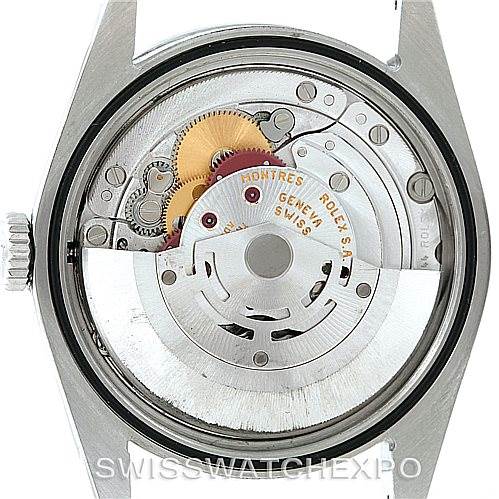 The image shows the interior mechanism of the Rolex Explorer 114270 Men's Stainless Steel Black Dial 114270 Men's Stainless Steel Black Dial watch, including gears, coils, and the oscillating weight.