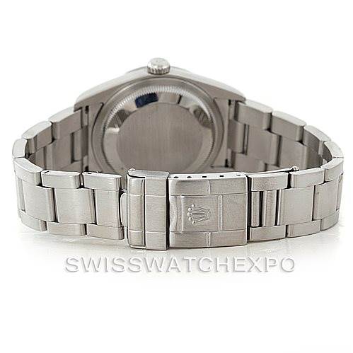 The image shows the backside view of a Rolex Explorer 114270 Men's Stainless Steel Black Dial 114270 Men's Stainless Steel Black Dial watch, focusing on its stainless steel case, bracelet, and clasp.