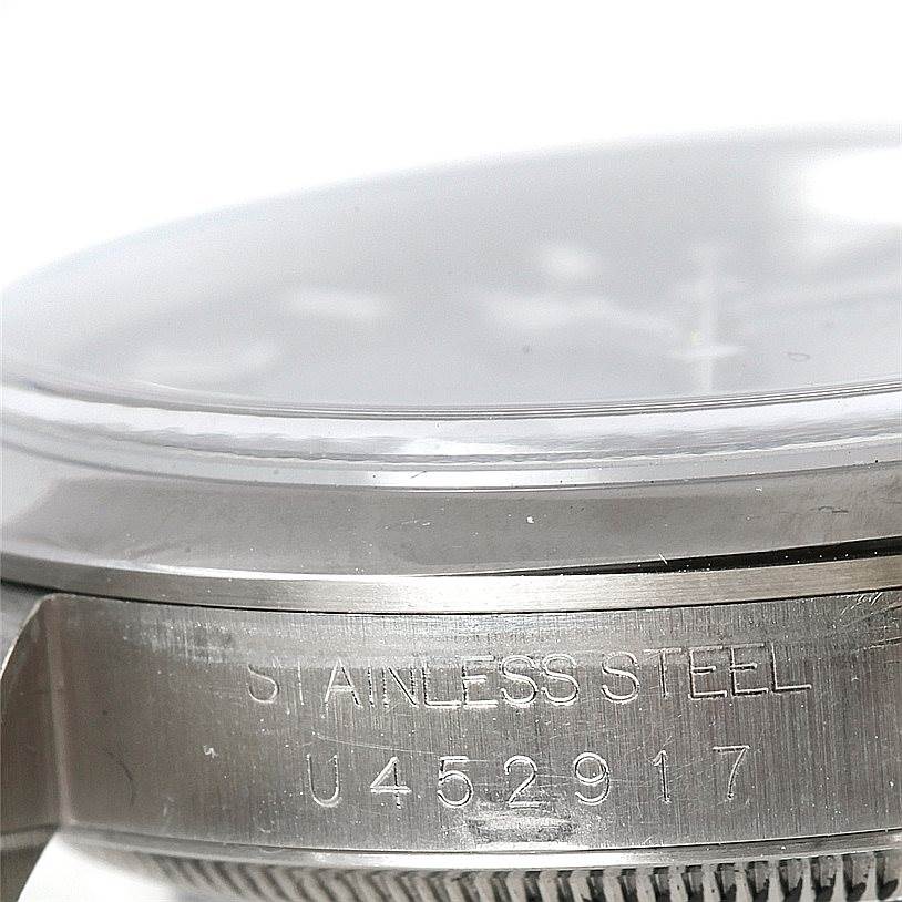 This image shows a close-up of the stainless steel case side and part of the bezel of a Rolex Explorer 14270 Men's Stainless Steel Black Dial 14270 Men's Stainless Steel Black Dial watch.