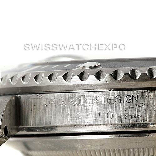 This image shows a close-up of the side and bezel of a Rolex Explorer 16570 Men
s Stainless Steel White Dial 16570 Men
s Stainless Steel White Dial watch, highlighting the "ORIG ROLEX DESIGN" engraving.