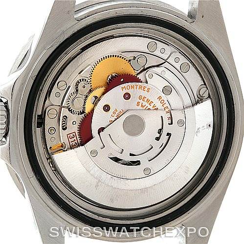 The image shows a close-up of the Rolex Explorer 16570 Men
s Stainless Steel White Dial 16570 Men
s Stainless Steel White Dial
s movement, revealing the intricate internal mechanics and gears.