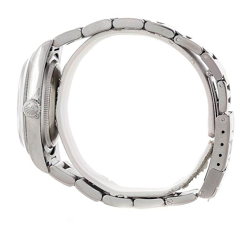 This image shows a side view of the Rolex Explorer 14270 Men's Stainless Steel Black Dial 14270 Men's Stainless Steel Black Dial watch, focusing on the crown, case, and bracelet links.