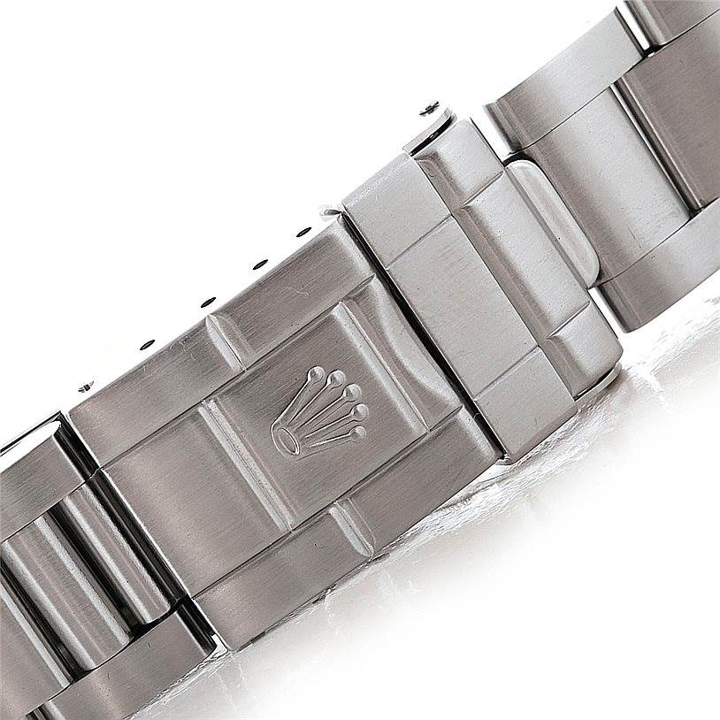 The image shows a close-up of the clasp on the bracelet of a Rolex Explorer 16570 Men's Stainless Steel Black Dial 16570 Men's Stainless Steel Black Dial model watch.