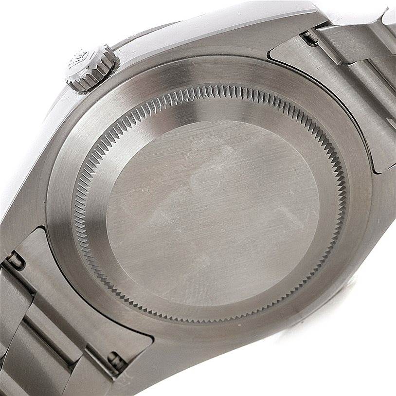 This image shows the case back, crown, and part of the bracelet of a Rolex Explorer 214270 Men's Stainless Steel Black Dial 214270 Men's Stainless Steel Black Dial watch.