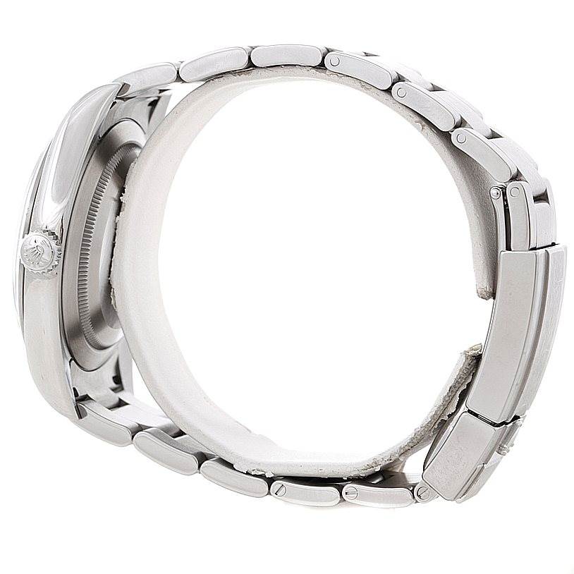 The image displays a side view of a Rolex Explorer 214270 Men's Stainless Steel Black Dial 214270 Men's Stainless Steel Black Dial watch focusing on the bezel, crown, and metal bracelet.