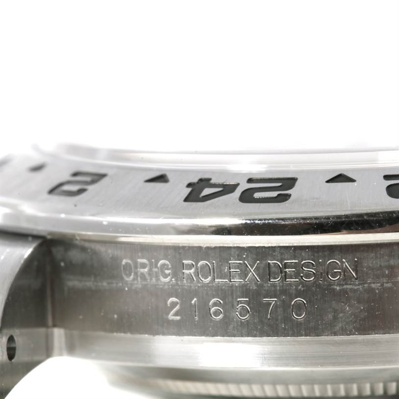 The image shows a close-up side view of the bezel and case of a Rolex Explorer 216570 Men's Stainless Steel White Dial 216570 Men's Stainless Steel White Dial watch, highlighting the model number "216570."
