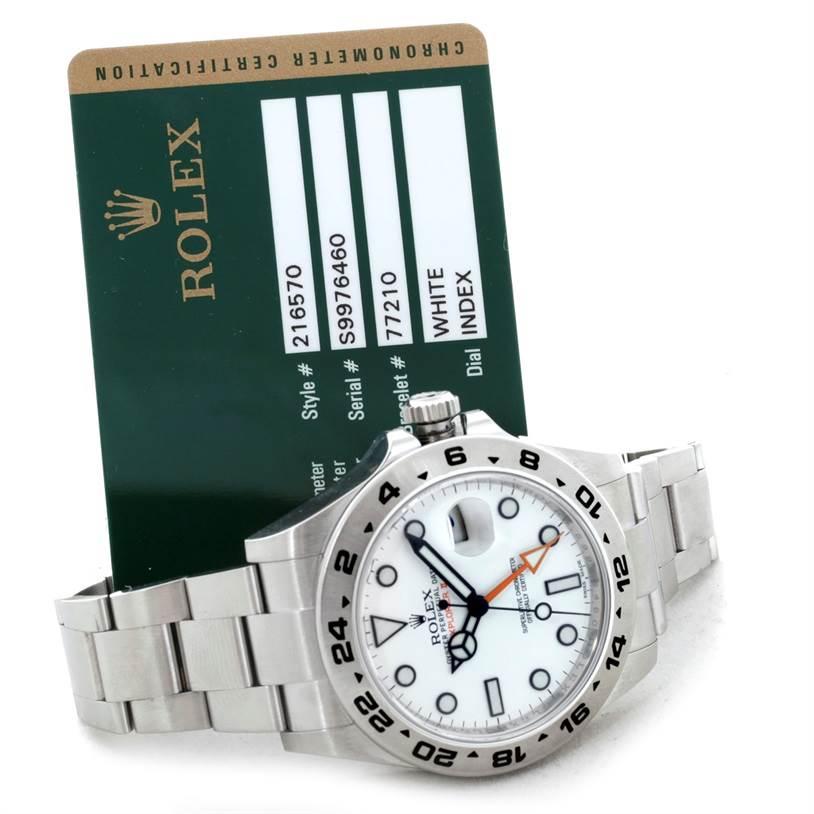This image shows a Rolex Explorer 216570 Men's Stainless Steel White Dial 216570 Men's Stainless Steel White Dial watch angled to display the face, crown, and part of the bracelet, along with a Rolex certification card.
