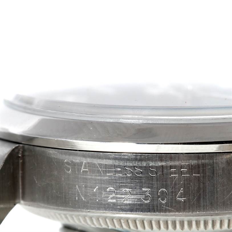 This close-up side view of the Rolex Explorer 14270 Men's Stainless Steel Black Dial 14270 Men's Stainless Steel Black Dial watch displays the stainless steel case with engraved text.