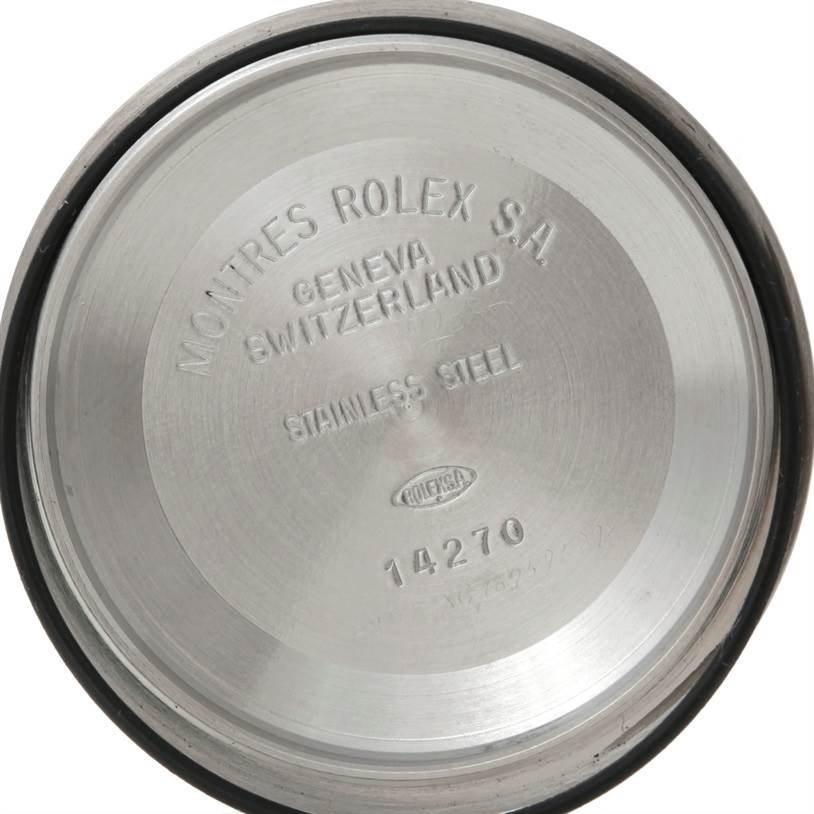 The image shows the interior of a stainless steel case back of a Rolex Explorer 14270 Men's Stainless Steel Black Dial 14270 Men's Stainless Steel Black Dial model 14270 watch.