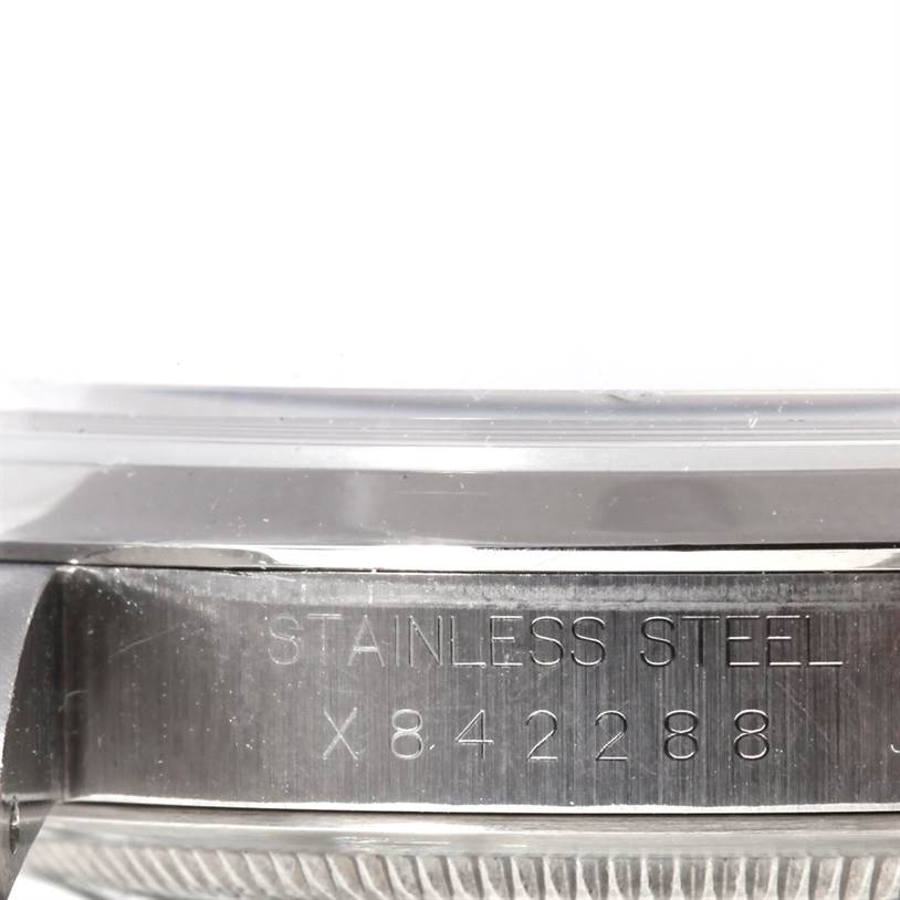 This image shows a close-up of the case side and serial number engraving on a Rolex Explorer 14270 Men's Stainless Steel Black Dial 14270 Men's Stainless Steel Black Dial model watch.