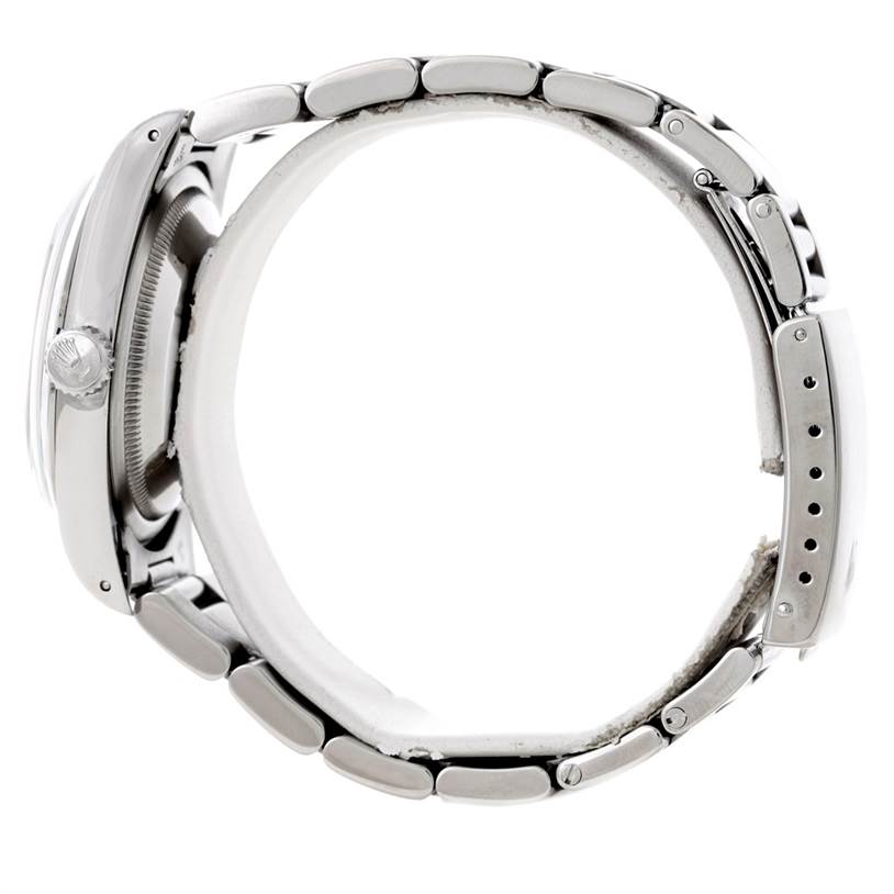 This side-angle view of the Rolex Explorer 14270 Men's Stainless Steel Black Dial 14270 Men's Stainless Steel Black Dial watch shows the bracelet, case, and crown.