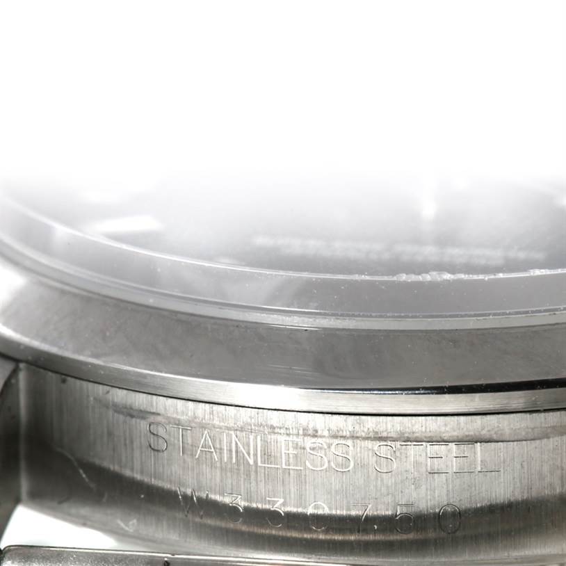 The image shows a close-up, side view of the stainless steel case back of a Rolex Explorer 14270 Men's Stainless Steel Black Dial 14270 Men's Stainless Steel Black Dial watch, partially displaying the engraving.