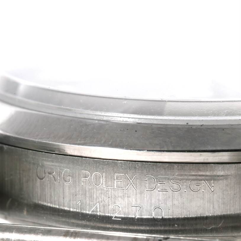 The image shows a close-up of the bezel and engraved case side of a Rolex Explorer 14270 Men's Stainless Steel Black Dial 14270 Men's Stainless Steel Black Dial watch.