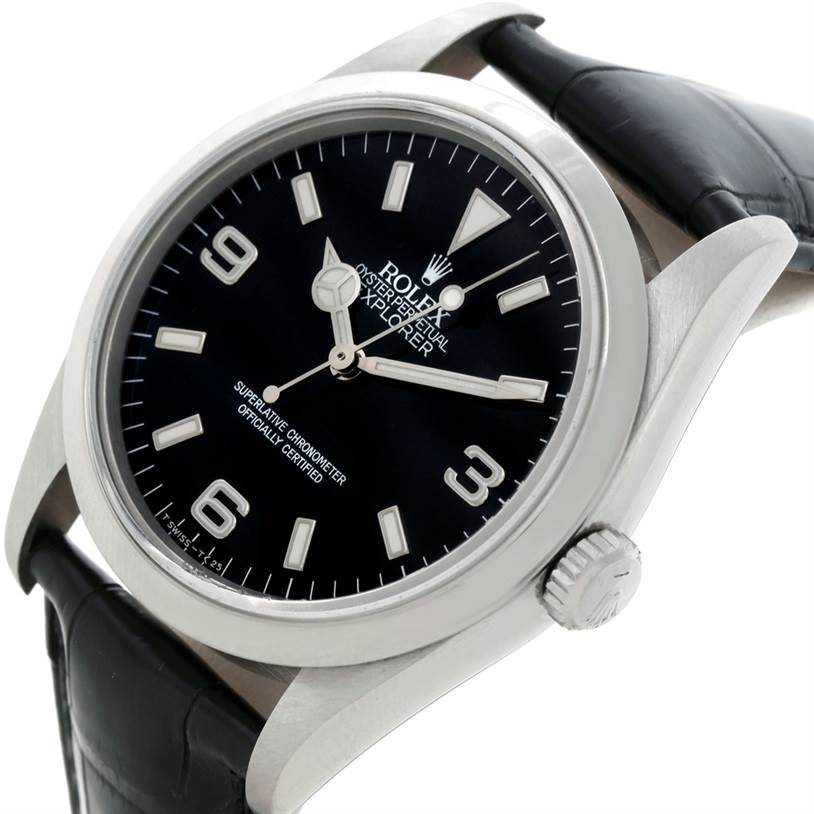 The Rolex Explorer 14270 Men's Stainless Steel Black Dial 14270 Men's Stainless Steel Black Dial watch is shown at an angled close-up, highlighting its dial, hands, crown, and black leather strap.