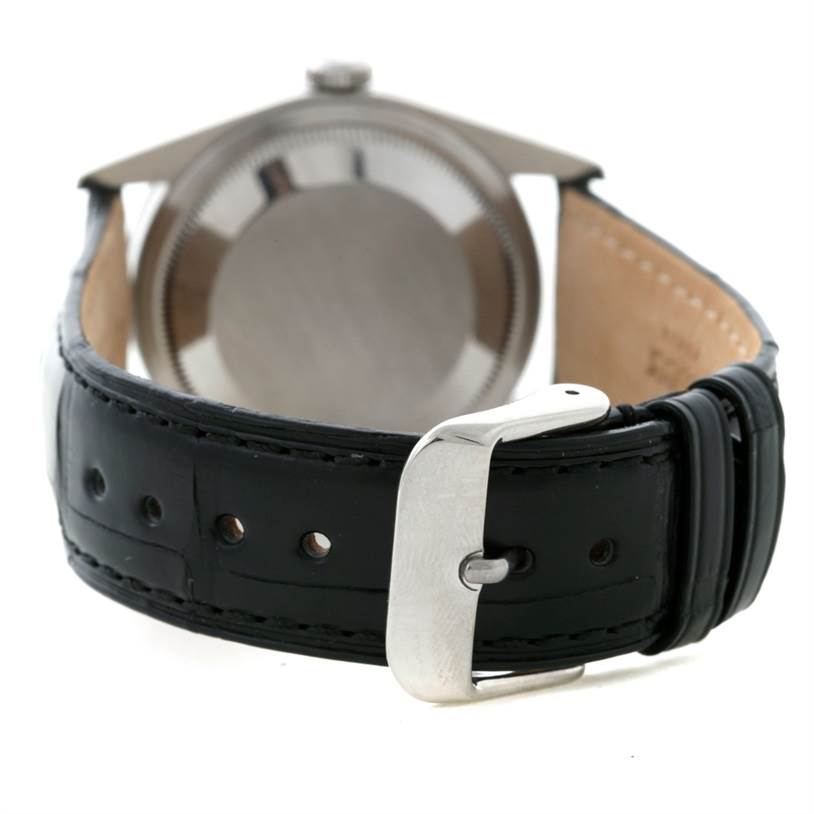 The image shows the back of the Rolex Explorer 14270 Men's Stainless Steel Black Dial 14270 Men's Stainless Steel Black Dial watch and its leather strap with a buckle.