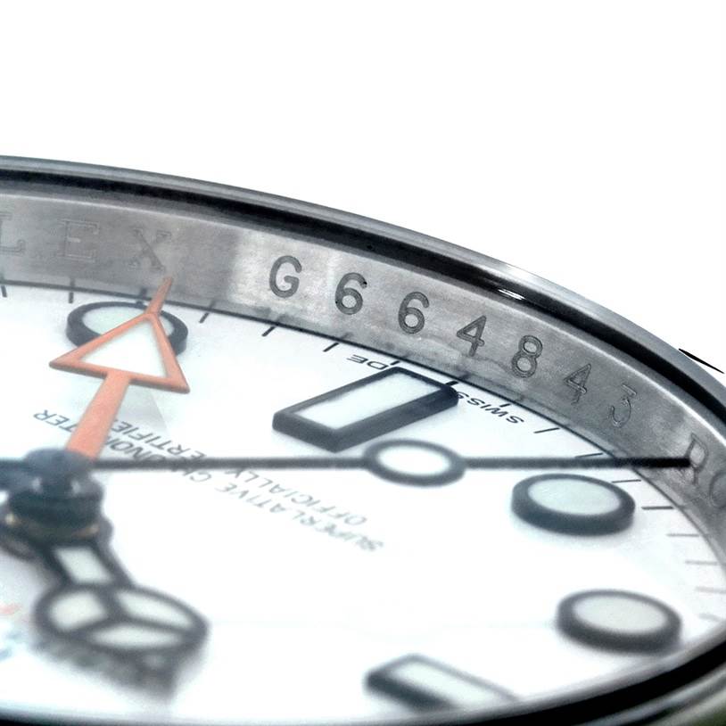 This close-up angle shows the dial and partial face of the Rolex Explorer 216570 Men
s Stainless Steel White Dial 216570 Men
s Stainless Steel White Dial model, highlighting the serial number engraved on the inner bezel.