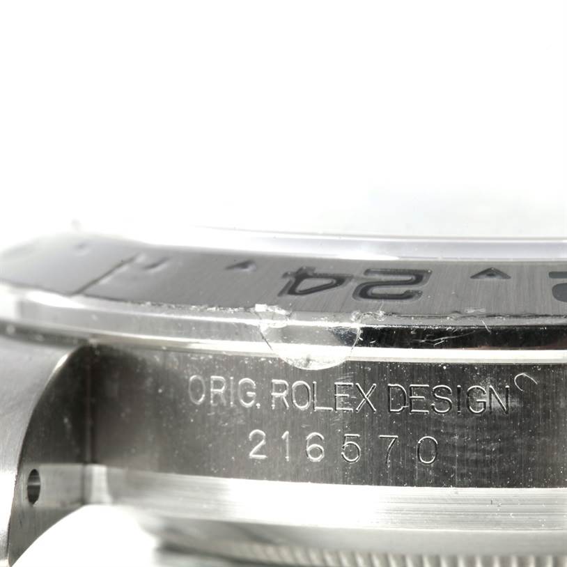 The image shows a close-up of the side of a Rolex Explorer 216570 Men's Stainless Steel White Dial 216570 Men's Stainless Steel White Dial watch, highlighting the case and bezel with its model number 216570 engraved.