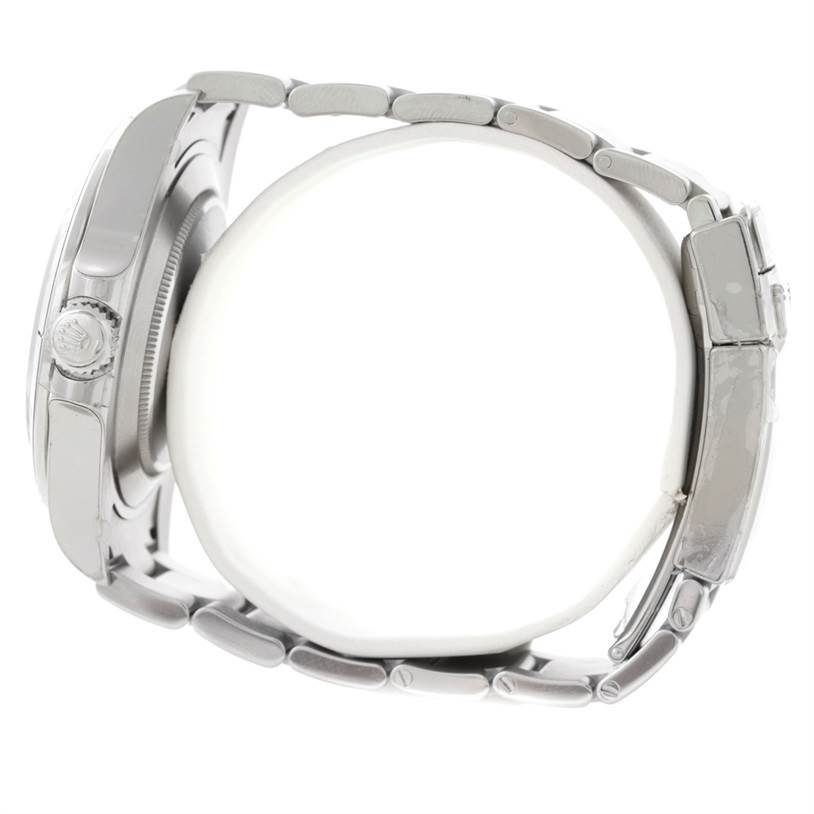 The image shows a side view of the Rolex Explorer 216570 Men's Stainless Steel White Dial 216570 Men's Stainless Steel White Dial watch, highlighting its case, crown, and metal bracelet.