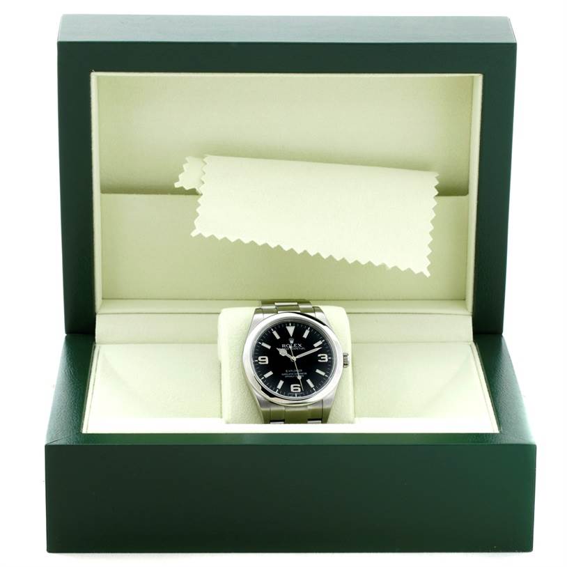 The image shows a Rolex Explorer 214270 Men's Stainless Steel Black Dial 214270 Men's Stainless Steel Black Dial watch displayed in its green box, viewed from the front.