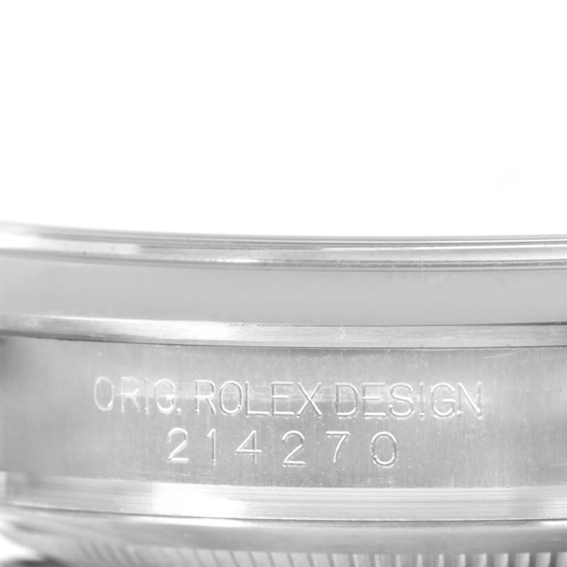 This close-up image shows the side engraving of a Rolex Explorer 214270 Men's Stainless Steel Black Dial 214270 Men's Stainless Steel Black Dial watch, displaying the "ORIG. ROLEX DESIGN 214270".