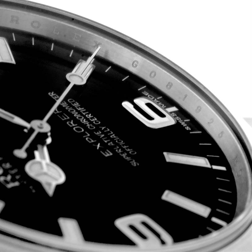 The image shows a close-up angled view of the face and bezel of a Rolex Explorer 214270 Men's Stainless Steel Black Dial 214270 Men's Stainless Steel Black Dial watch.