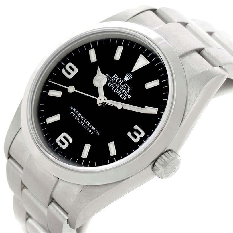 This image shows a close-up angled view of the Rolex Explorer 114270 Men's Stainless Steel Black Dial 114270 Men's Stainless Steel Black Dial's dial, bezel, and part of the bracelet.