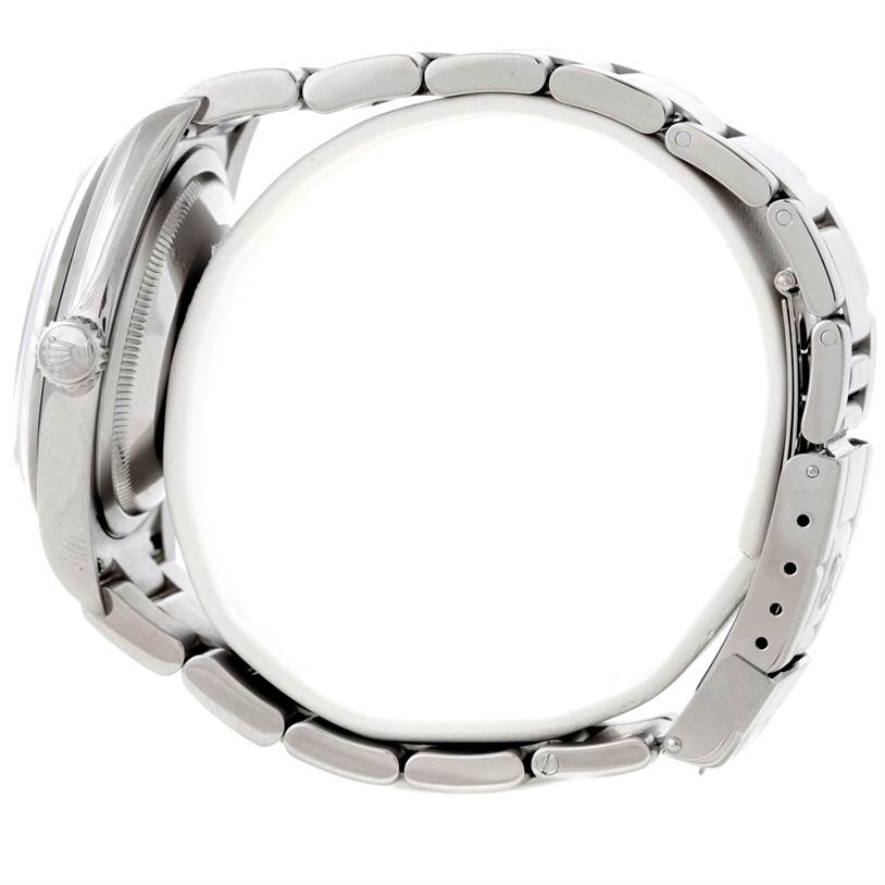 This side view of the Rolex Explorer 114270 Men's Stainless Steel Black Dial 114270 Men's Stainless Steel Black Dial watch showcases the crown, case, and bracelet with clasp.