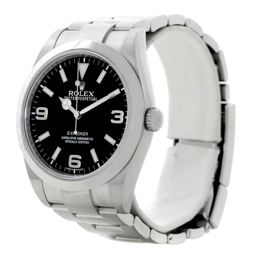 The Rolex Explorer 214270 Men's Stainless Steel Black Dial 214270 Men's Stainless Steel Black Dial watch is shown from a front-left angle, highlighting its dial, bezel, crown, and bracelet.