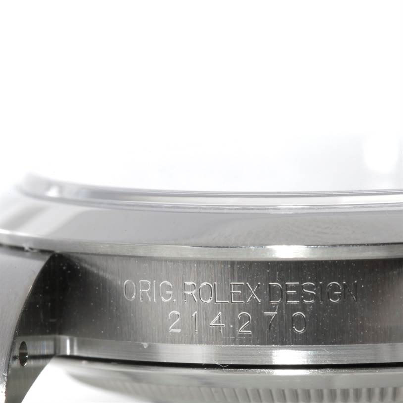 This image shows the side view of the casing for the Rolex Explorer 214270 Men's Stainless Steel Black Dial 214270 Men's Stainless Steel Black Dial watch, featuring the model number and "ORIG ROLEX DESIGN" engraving.