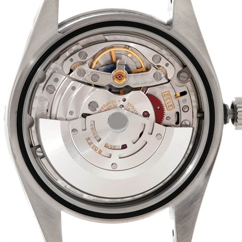 This image shows the back view of a Rolex Explorer 214270 Men's Stainless Steel Black Dial 214270 Men's Stainless Steel Black Dial watch, highlighting its intricate internal movement.