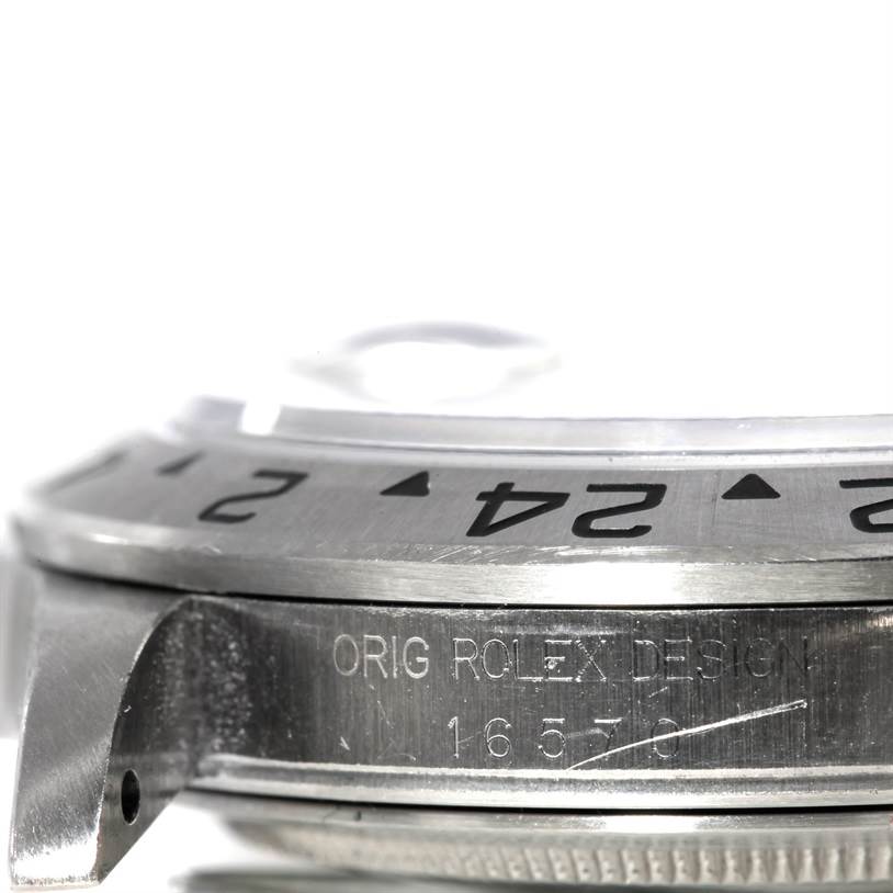 The image shows the side view of a Rolex Explorer 16570 Men's Stainless Steel White Dial 16570 Men's Stainless Steel White Dial watch, highlighting the bezel and engraved model number.