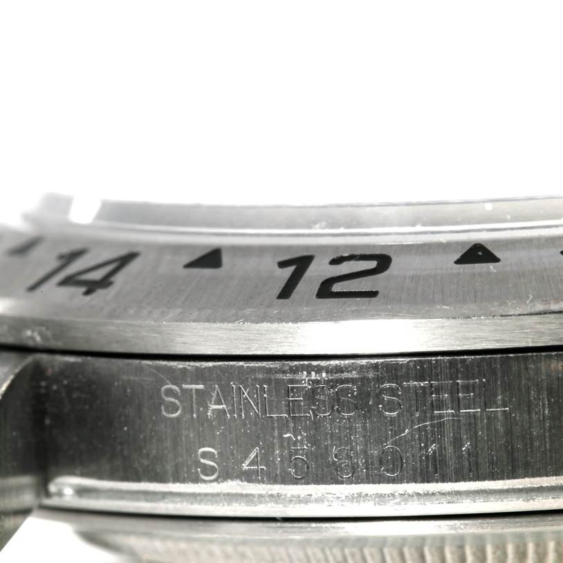 This close-up image shows the bezel and inner case of the Rolex Explorer 16570 Men's Stainless Steel White Dial 16570 Men's Stainless Steel White Dial watch, highlighting the stainless steel material.