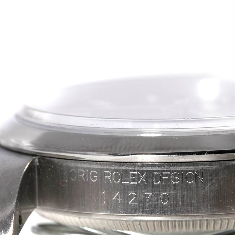 The image shows the side view of the Rolex Explorer 14270 Men's Stainless Steel Black Dial 14270 Men's Stainless Steel Black Dial watch, focusing on the inscribed case's edge.